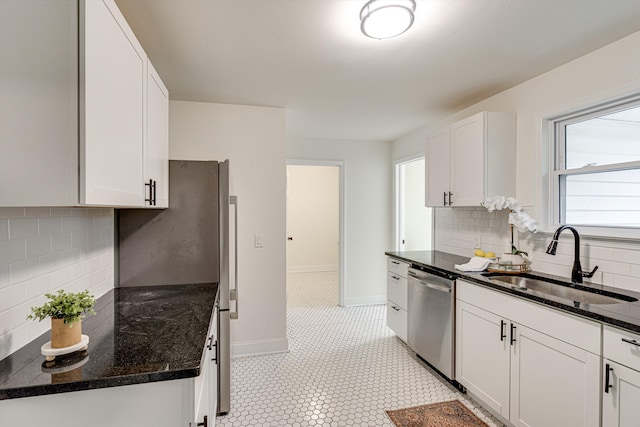 3706 Altamira Dr, Chattanooga, TN 37412 - kitchen featuring stainless steel dishwasher, tasteful backsplash, white cabinets, and dark stone countertops