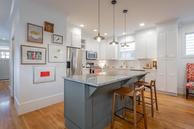661 E 16th St, Chattanooga, TN 37408 - kitchen with stainless steel appliances, open shelves, healthy amount of natural light, backsplash, and recessed lighting