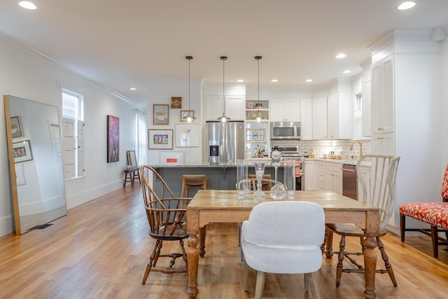 661 E 16th St, Chattanooga, TN 37408 - dining space featuring light wood-type flooring, ornamental molding, and recessed lighting
