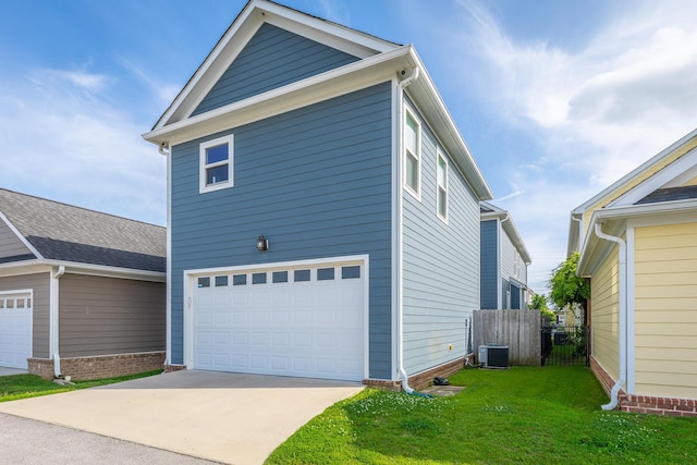 661 E 16th St, Chattanooga, TN 37408 - view of home's exterior featuring an attached garage and concrete driveway