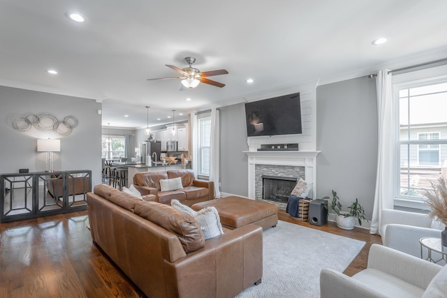 1023 Givens Rd, Chattanooga, TN 37421 - living room featuring a ceiling fan, recessed lighting, dark wood finished floors, ornamental molding, and a fireplace