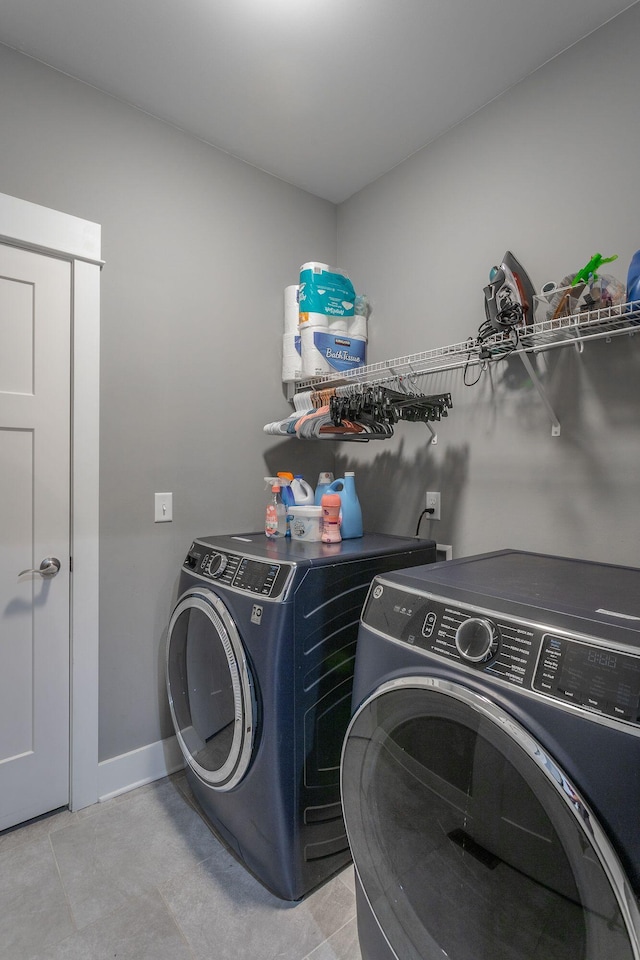 1023 Givens Rd, Chattanooga, TN 37421 - laundry area with washing machine and clothes dryer and light tile patterned flooring