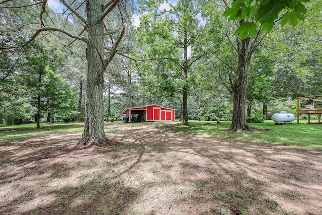176 Ola Dr, Cohutta, GA 30710 - view of yard with an outdoor structure, a garage, and an outbuilding