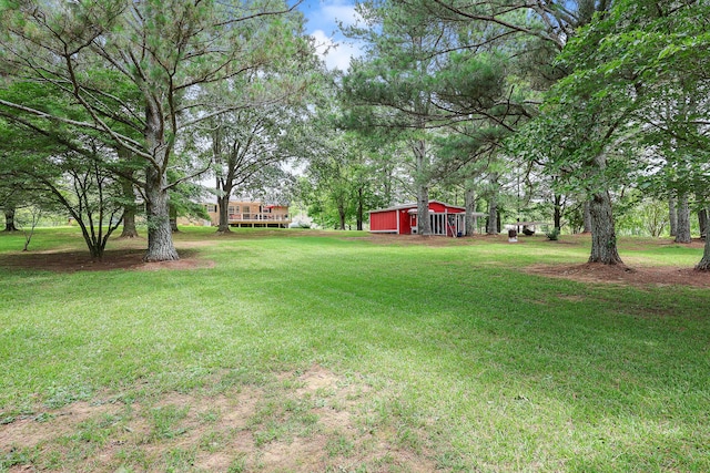 176 Ola Dr, Cohutta, GA 30710 - view of green lawn with an outdoor structure and a garage