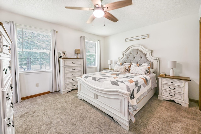 176 Ola Dr, Cohutta, GA 30710 - bedroom with light carpet, a textured ceiling, and a ceiling fan