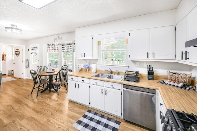 176 Ola Dr, Cohutta, GA 30710 - kitchen with stainless steel dishwasher, gas range oven, white cabinets, light wood-type flooring, and a textured ceiling