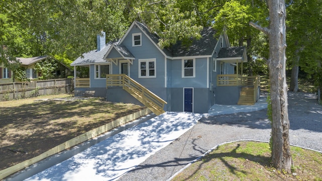 3018 14th Ave, Chattanooga, TN 37407 - view of front facade with a chimney and roof with shingles