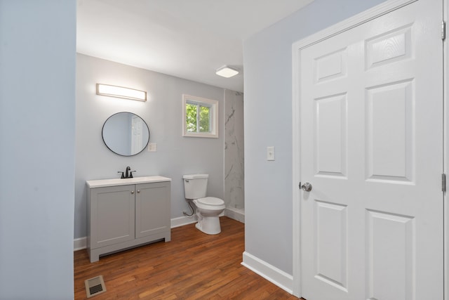 3018 14th Ave, Chattanooga, TN 37407 - bathroom with a marble finish shower, vanity, and wood finished floors