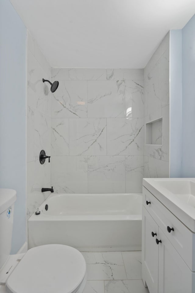 3018 14th Ave, Chattanooga, TN 37407 - bathroom featuring marble look tiles, vanity, and bathtub / shower combination