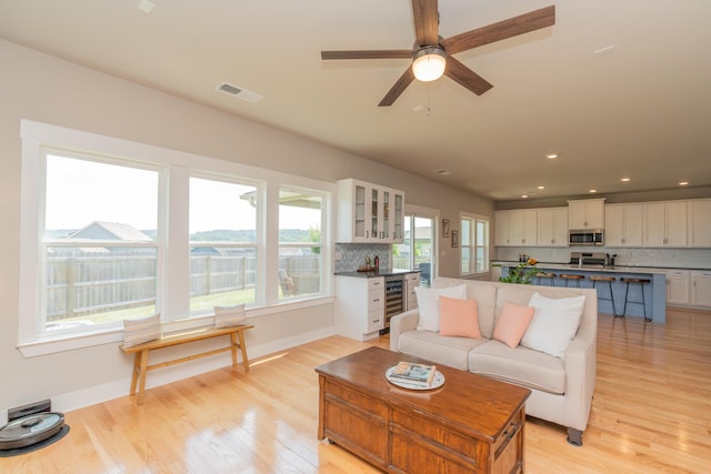 3328 Prairie Range Ln, Apison, TN 37302 - living room with light wood-style floors, ceiling fan, recessed lighting, and beverage cooler