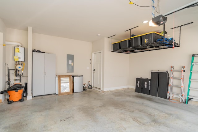 3328 Prairie Range Ln, Apison, TN 37302 - garage with electric panel, a garage door opener, and water heater