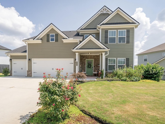 3328 Prairie Range Ln, Apison, TN 37302 - craftsman-style house with a front yard, concrete driveway, stone siding, and an attached garage