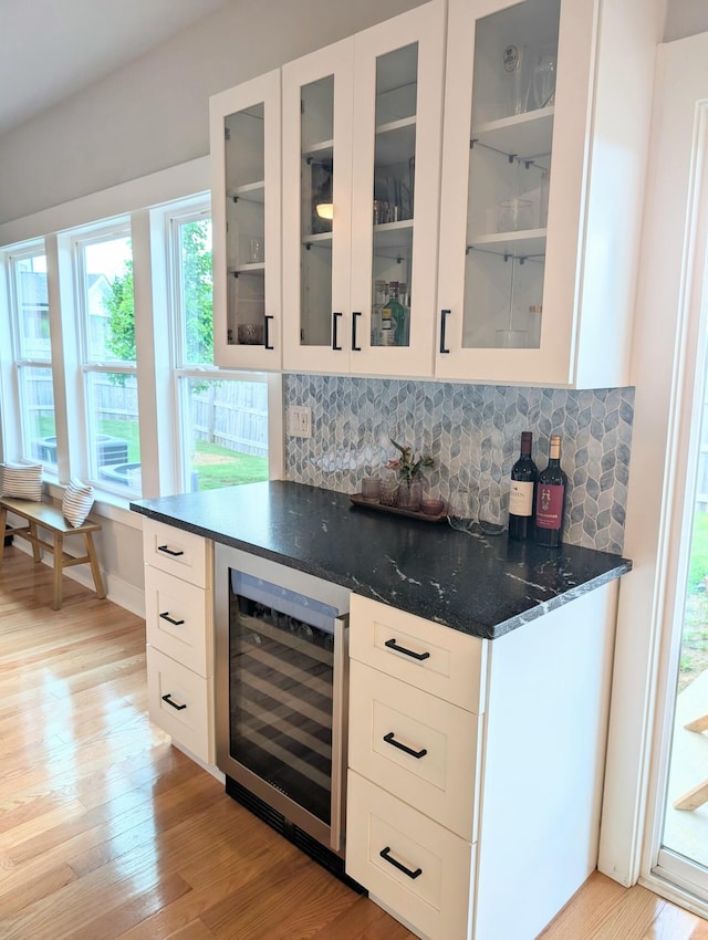 3328 Prairie Range Ln, Apison, TN 37302 - indoor dry bar with beverage cooler, tasteful backsplash, and light wood-type flooring