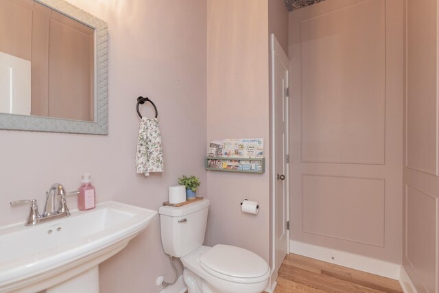3328 Prairie Range Ln, Apison, TN 37302 - half bathroom featuring a sink and wood finished floors
