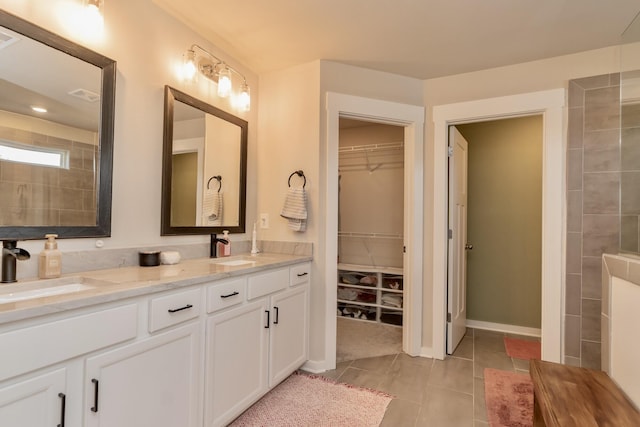 3328 Prairie Range Ln, Apison, TN 37302 - bathroom featuring double vanity, a walk in closet, and tile patterned flooring