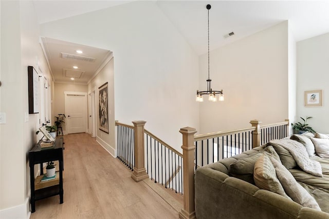 7596 Grasshopper Rd, Georgetown, TN 37336 - corridor featuring light wood-style flooring, an upstairs landing, high vaulted ceiling, a chandelier, and recessed lighting