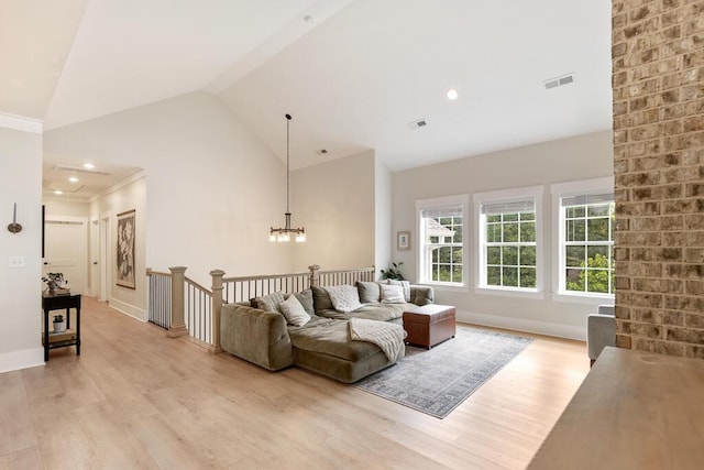 7596 Grasshopper Rd, Georgetown, TN 37336 - living room featuring light wood-type flooring, high vaulted ceiling, and a chandelier
