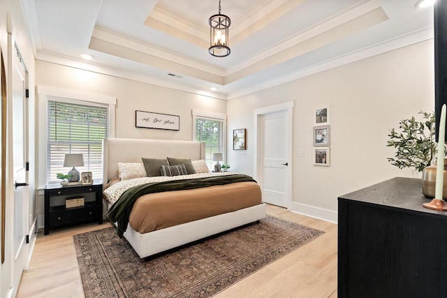 7596 Grasshopper Rd, Georgetown, TN 37336 - bedroom featuring crown molding, light wood-style floors, and a tray ceiling