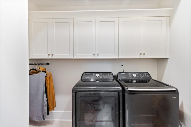 7596 Grasshopper Rd, Georgetown, TN 37336 - washroom featuring washing machine and dryer and cabinet space