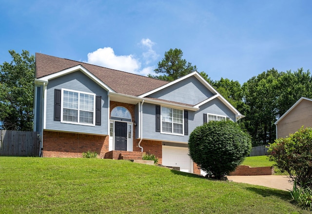6220 Hunter Valley Rd, Ooltewah, TN 37363 - split foyer home with brick siding, an attached garage, and roof with shingles
