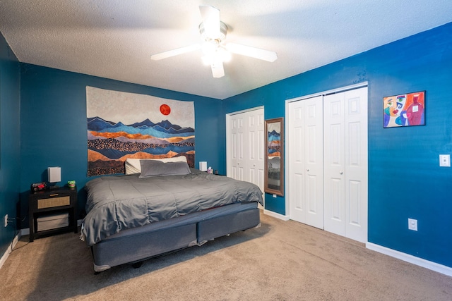 6220 Hunter Valley Rd, Ooltewah, TN 37363 - bedroom featuring carpet floors, two closets, ceiling fan, and a textured ceiling