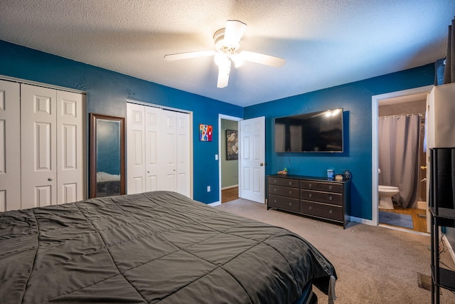 6220 Hunter Valley Rd, Ooltewah, TN 37363 - bedroom featuring two closets, carpet floors, a textured ceiling, a ceiling fan, and connected bathroom