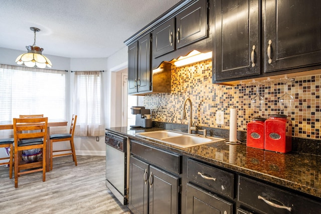 6220 Hunter Valley Rd, Ooltewah, TN 37363 - kitchen with dishwasher, tasteful backsplash, a textured ceiling, light wood-type flooring, and dark stone counters