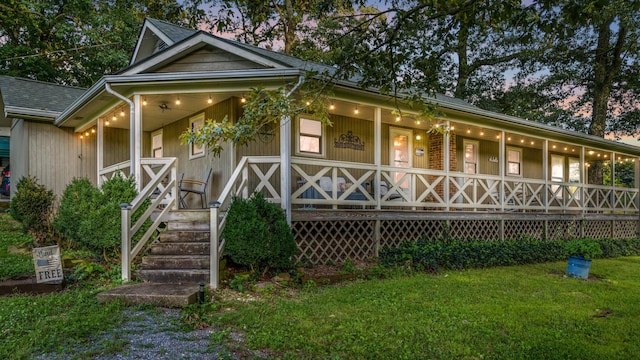 684 Mcconnell Xing, Lafayette, GA 30728 - view of front of property with covered porch, a front yard, and roof with shingles