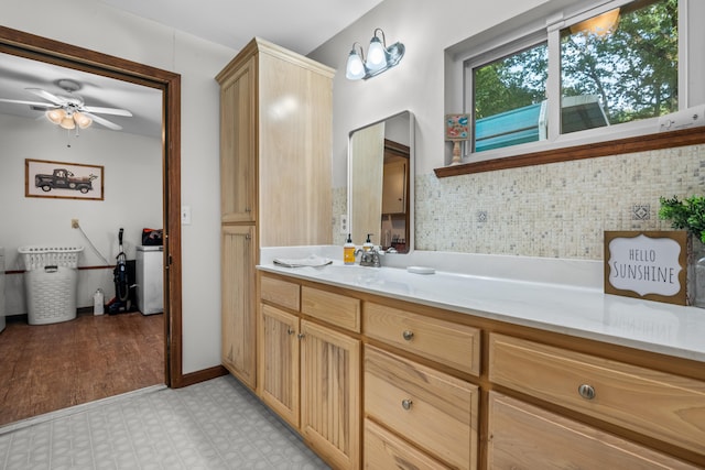 684 Mcconnell Xing, Lafayette, GA 30728 - bathroom with tile patterned floors, ceiling fan, vanity, and tasteful backsplash