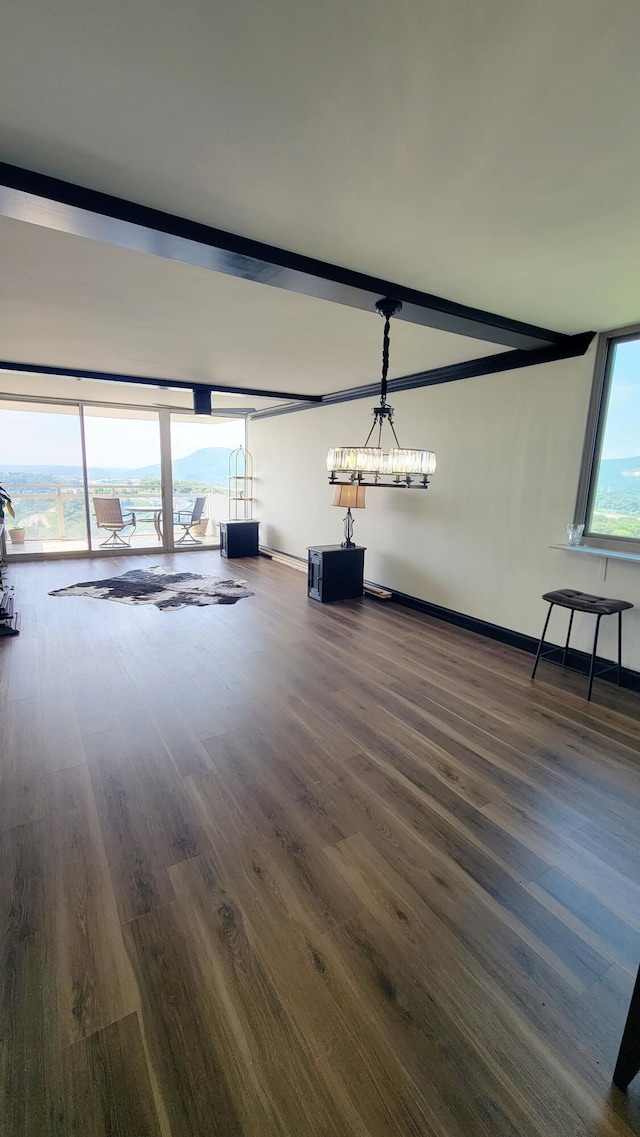 1131 Stringers Ridge Rd Unit 12H, Chattanooga, TN 37405 - unfurnished living room featuring dark wood-style flooring and baseboards