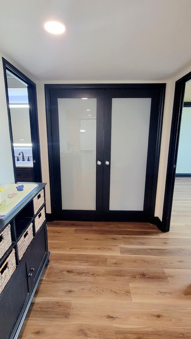 1131 Stringers Ridge Rd Unit 12H, Chattanooga, TN 37405 - hall with light wood-style floors and french doors