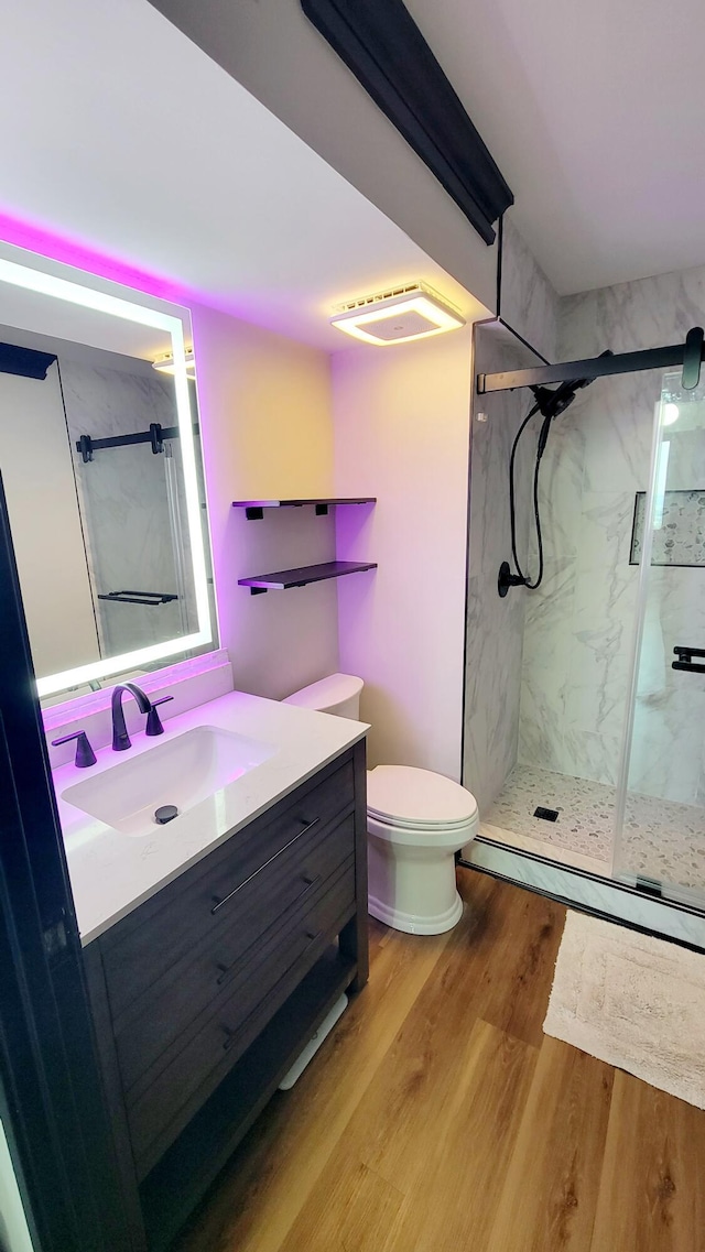 1131 Stringers Ridge Rd Unit 12H, Chattanooga, TN 37405 - full bath with a marble finish shower, vanity, a baseboard heating unit, and wood finished floors
