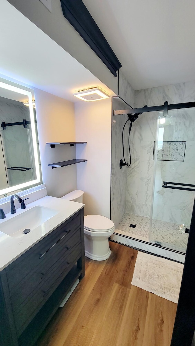1131 Stringers Ridge Rd Unit 12H, Chattanooga, TN 37405 - full bathroom featuring a marble finish shower, vanity, wood finished floors, and a baseboard radiator