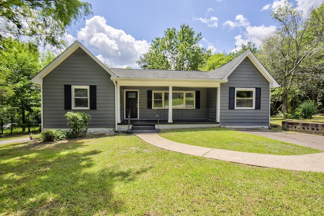 1728 John Ross Rd, Chattanooga, TN 37412 - ranch-style house featuring a porch, a front yard, and a shingled roof