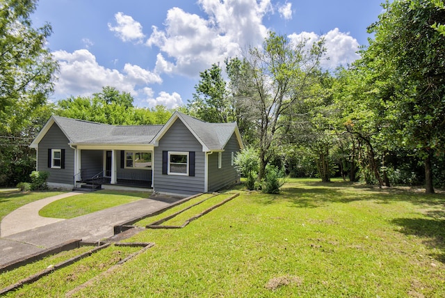 1728 John Ross Rd, Chattanooga, TN 37412 - view of front of property with covered porch, a front yard, and roof with shingles