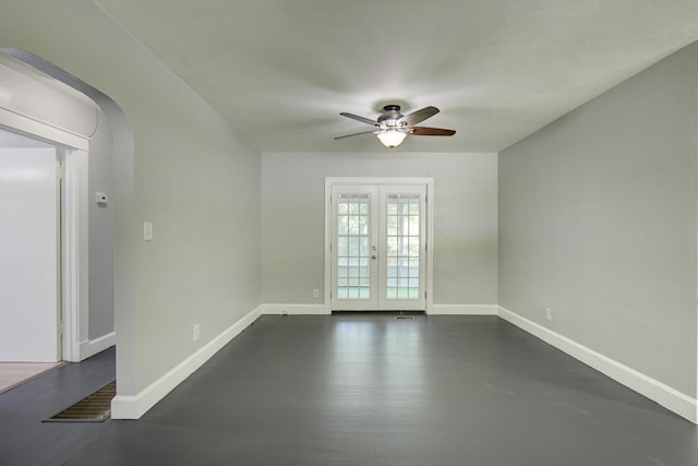 1728 John Ross Rd, Chattanooga, TN 37412 - spare room featuring a ceiling fan, french doors, arched walkways, and dark wood-style floors