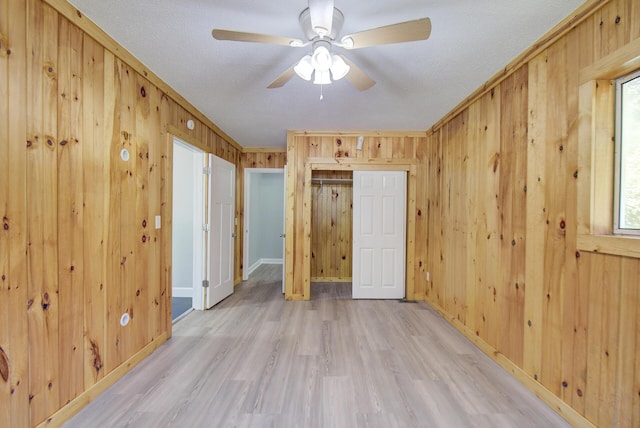1728 John Ross Rd, Chattanooga, TN 37412 - empty room featuring wooden walls, light wood-style floors, and ceiling fan