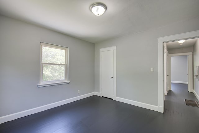 1728 John Ross Rd, Chattanooga, TN 37412 - unfurnished bedroom featuring dark wood-type flooring and a closet
