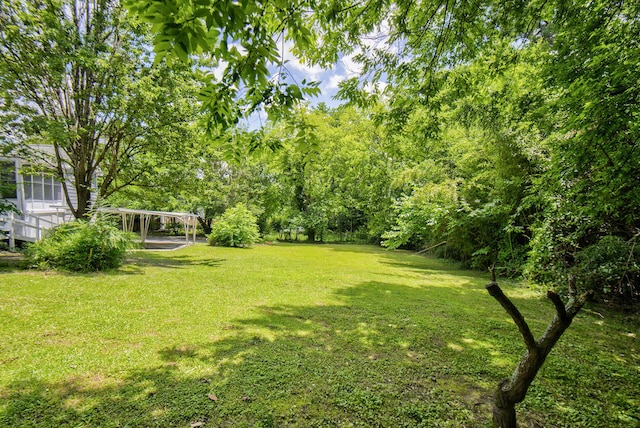 1728 John Ross Rd, Chattanooga, TN 37412 - view of grassy yard with a detached carport