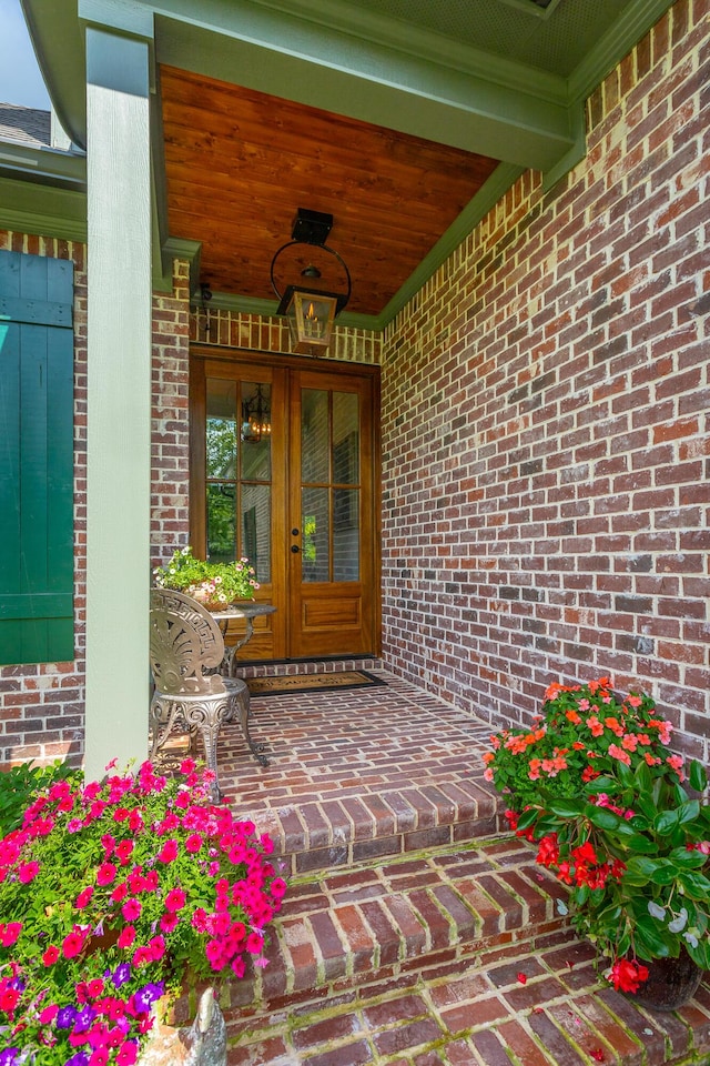 3117 Greenwich Ave, Chattanooga, TN 37415 - property entrance featuring french doors, brick siding, and covered porch