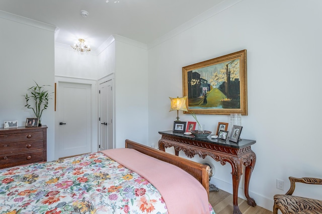 3117 Greenwich Ave, Chattanooga, TN 37415 - bedroom with crown molding, wood finished floors, and a chandelier