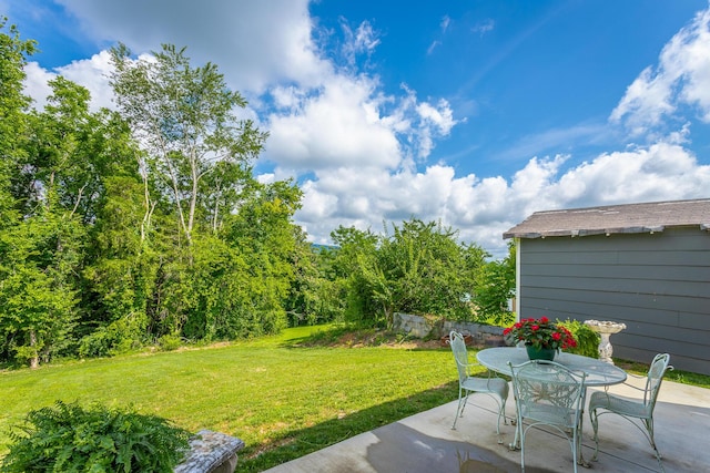 3117 Greenwich Ave, Chattanooga, TN 37415 - view of green lawn featuring a patio and outdoor dining area
