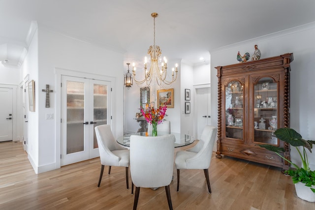 3117 Greenwich Ave, Chattanooga, TN 37415 - dining room with french doors, crown molding, light wood-type flooring, and a chandelier