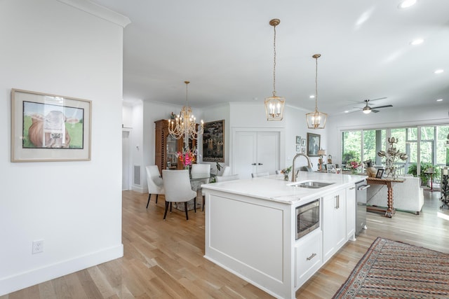3117 Greenwich Ave, Chattanooga, TN 37415 - kitchen featuring stainless steel microwave, a chandelier, open floor plan, recessed lighting, and white cabinetry