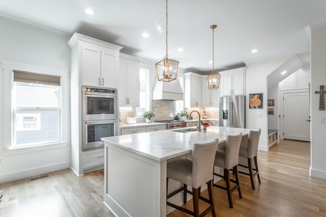 3117 Greenwich Ave, Chattanooga, TN 37415 - kitchen featuring stainless steel appliances, tasteful backsplash, light wood-type flooring, a chandelier, and recessed lighting