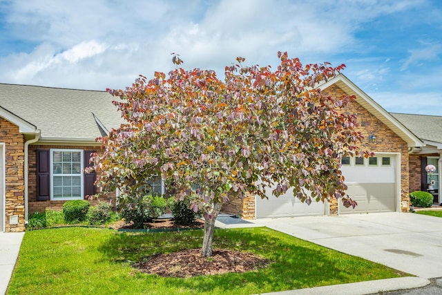 802 Applebrook Dr Unit 802, Rossville, GA 30741 - view of front of house featuring stone siding, roof with shingles, driveway, and a front yard