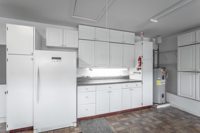 802 Applebrook Dr Unit 802, Rossville, GA 30741 - kitchen with freestanding refrigerator, electric water heater, white cabinets, and dark countertops
