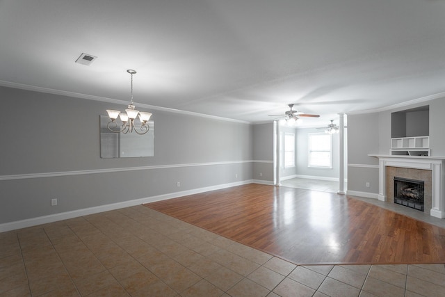 802 Applebrook Dr Unit 802, Rossville, GA 30741 - unfurnished living room with a chandelier, a ceiling fan, ornamental molding, tile patterned floors, and a tiled fireplace