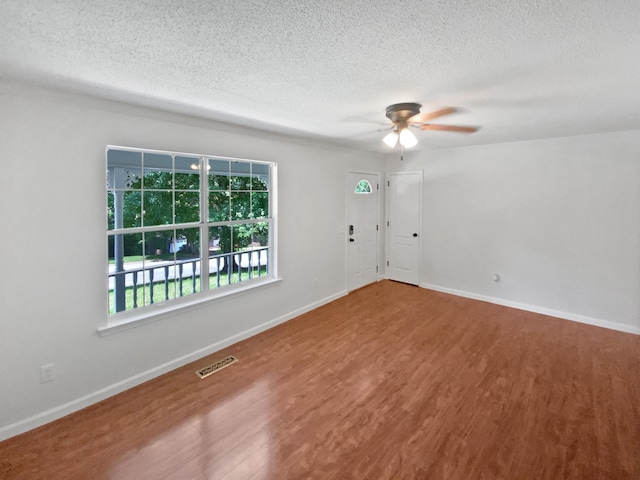 7110 Ridgestone Dr, Ooltewah, TN 37363 - spare room with ceiling fan, wood finished floors, and a textured ceiling