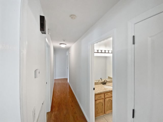 7110 Ridgestone Dr, Ooltewah, TN 37363 - corridor with light wood-style flooring and baseboards